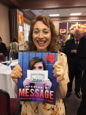 Regina Spektor '01 holds a copy of The Purchase Beat