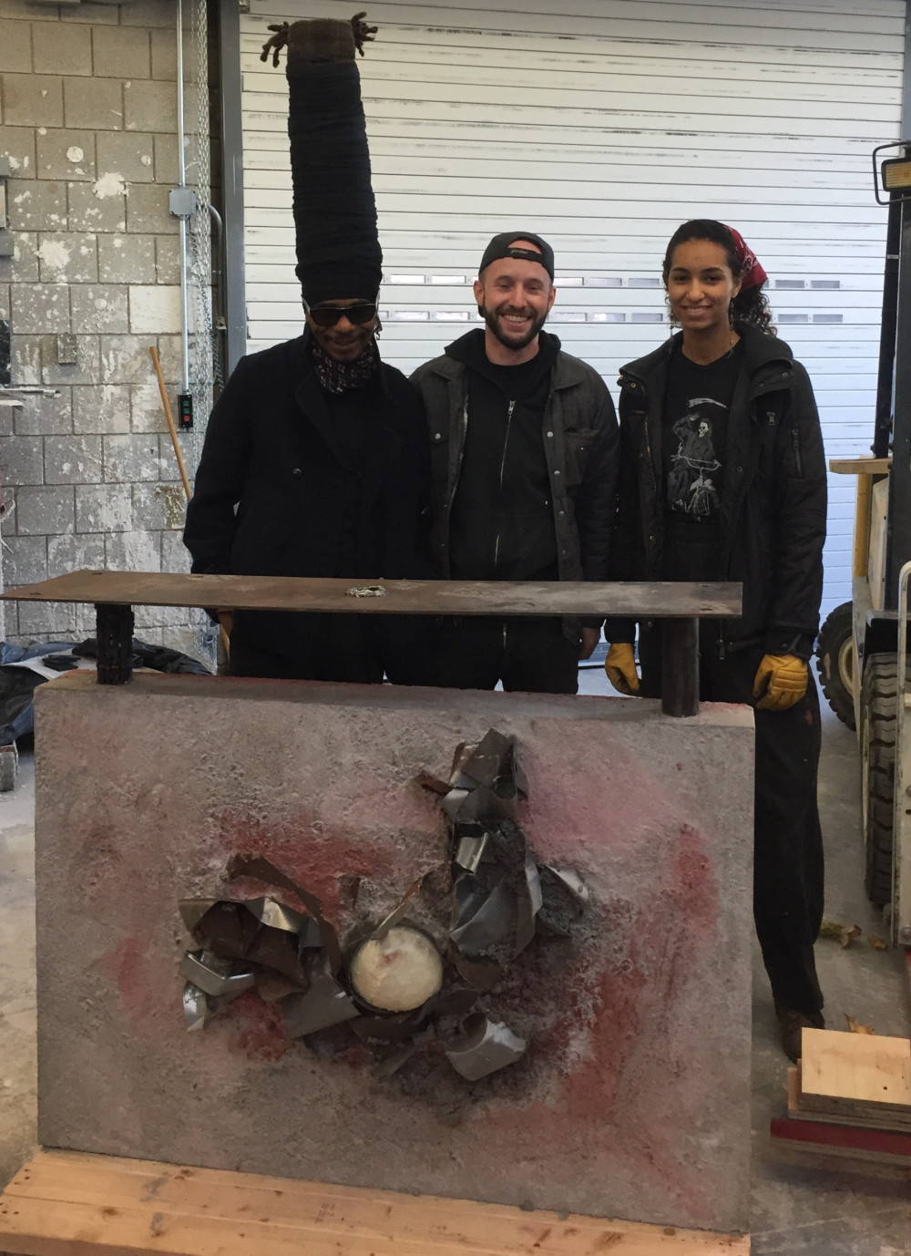From Left to right: Engels the Artist; 3-D Media Instructor Felix Matta-Fletcher; and student Gabriella Rosen pose with the final work of art.