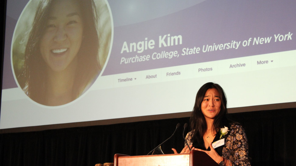 Angie Kim delivers remarks onstage at the 2018 Milli Awards