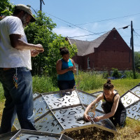 Students and collaborators work on American Riad project in Detroit