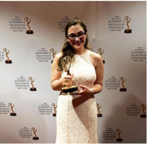 Rachel Weiss '16 holds her NYC Emmy