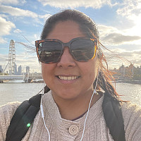 Stephanie Sanchez with London skyline behind.