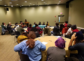 Students at a panel presentation.