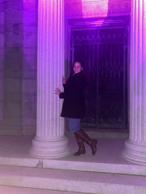 Skylar standing on steps at Woodlawn Cemetery