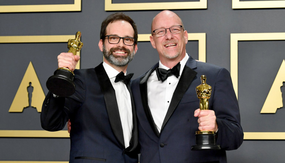 Andrew Buckland '94 (film) and longtime collaborator Michael McCusker earn the Oscar for film editing.