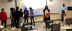Students are lined up and participating in a group activity.