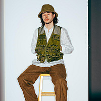 Sebastian sitting on a stool