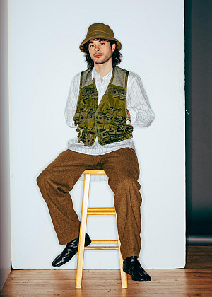 Sebastian sitting on a stool
