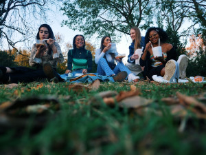 Students hanging out on grass