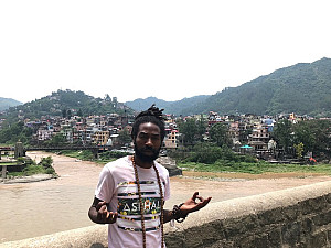 Student on a bridge in India