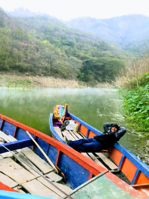 Man in boat in Rio Negro, Guatemala