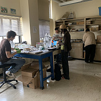 Students preparing for the earth day NSS fair by setting aside materials for compost jars!