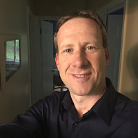 Headshot of Tom Kelly