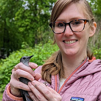 Dr. Jackson and her bird research subject