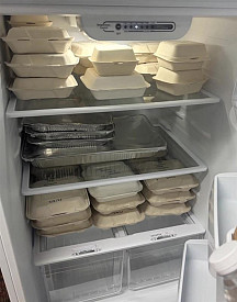 Communal fridge full of FRN recovery boxes for anyone to enjoy