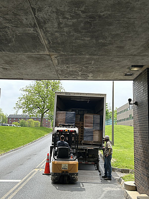 Furniture is loaded onto the back of a truck