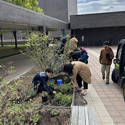 perennial planting 2023 Employees and students planting perennials outside of the Music building.