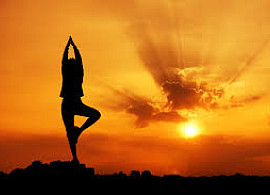 Yoga silhouette in front of sunset