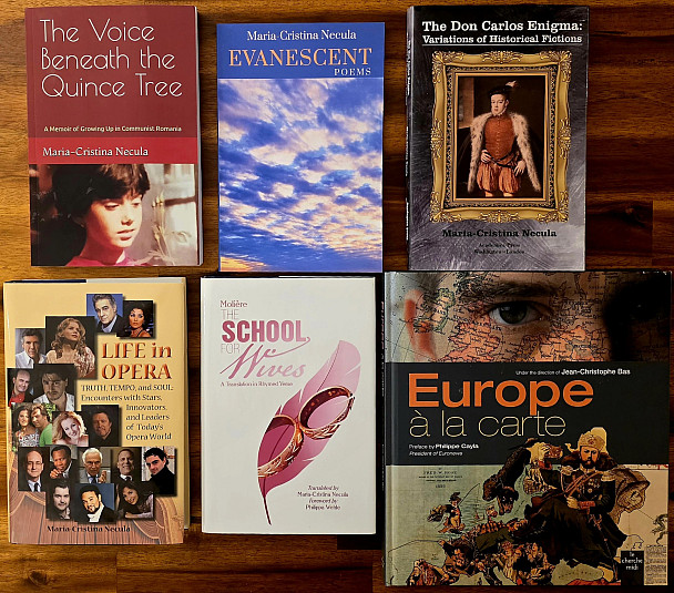 Six books are arranged on a wooden surface. The titles include The Voice Beneath the Quince Tree, Evanescent Poems, The Don Carlos Enigma,