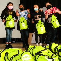 Distribution of NEU Kids Packs to local schoolkids at the Enrico Firmi School in Yonkers, NY.