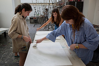 Visual Arts students priming canvases
