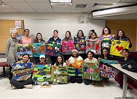 Dr. Luisa Piemontese (Purchase Alumna, class of 1982) with her students and their arpilleras