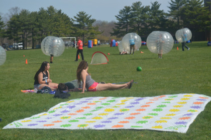 Students enjoying their afternoon on The Great Lawn at the Purchase Coliseum event.