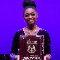 Samara Joy McLendon '21 holds her Sarah Vaughan Jazz Vocal award.