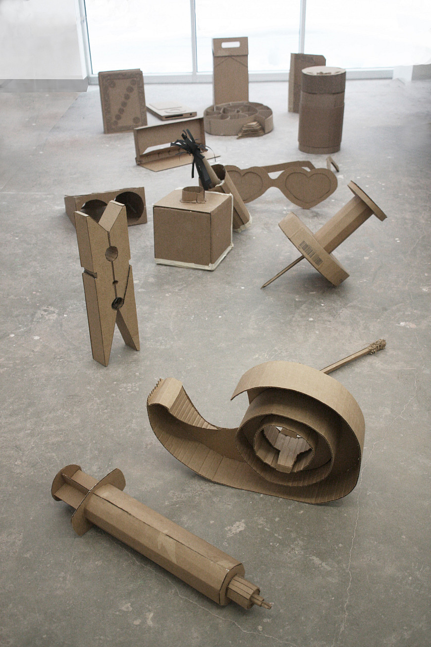 A collection of objects (including a clothes pin, match, and nail polish) that have been enlarged in 3-D Processes.