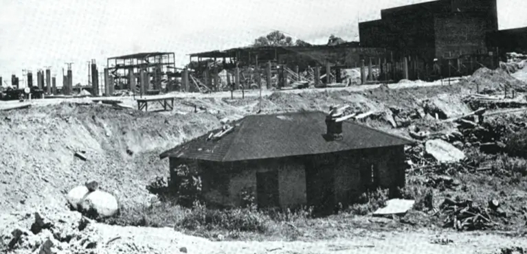 Construction of Neuberger Museum Art with old farm building.