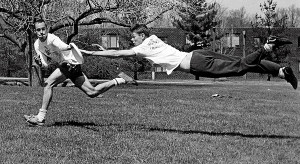 Dennis Warsen '90 stretches to catch frisbee on the Great Lawn