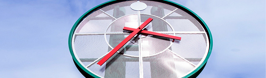 The clock tower in front of the Student Services Building