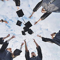 Graduates throwing caps in the air