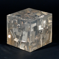    Luis Perelman, Industrial Petrification 2, 1965, Found materials embedded in clear resin, 5 7/16 x 5 9/16 x 5 9/16 inches. Courtesy of...