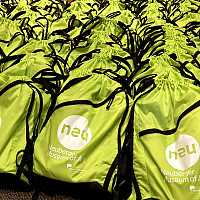 Collection of backpacks filled with art supplies ready for distribution