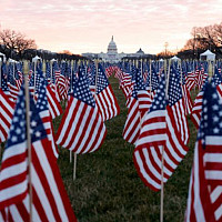 About 200,000 U.S., state and territorial flags were erected on the National Mall to represent the people unable to travel to Washington,...