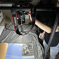    The archivist photographing scrapbooks from the Roy R. Neuberger Papers.    Photo by Diana Puglisi. 