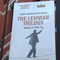 A banner for The Lehman Trilogy hanging outside the Park Avenue Armory in New York City