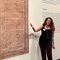 Neuberger Museum Director Tracy Fitzpatrick comments on a large format reproduction of the Holt Broadside.