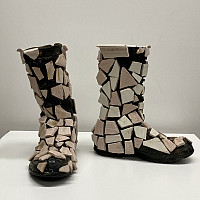 Bisque-fired ceramic plate, silicone on rubber Wellington boots.