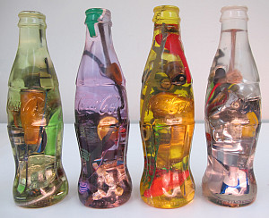 Luis Perelman Coca Cola Series, 1998 21 parts; found materials embedded in clear resin 7 ½ x 2 ¼ x 2 ¼ Courtesy of Luis Perelman