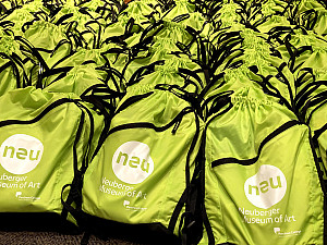 Collection of backpacks filled with art supplies ready for distribution