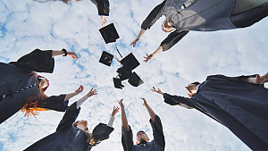 Graduates throwing caps in the air