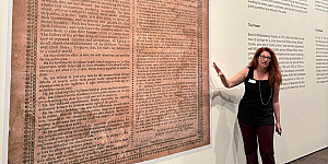 Neuberger Museum Director Tracy Fitzpatrick comments on a large format reproduction of the Holt Broadside.