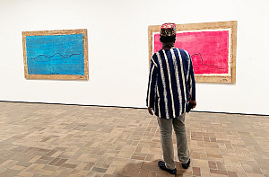 Romuald Hazoumè in the gallery of his retrospective exhibition, The Fâ Series