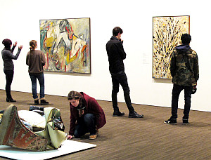 Purchase College students examining works of art from the Neuberger's collection
