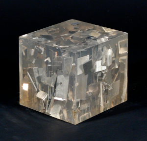    Luis Perelman, Industrial Petrification 2, 1965, Found materials embedded in clear resin, 5 7/16 x 5 9/16 x 5 9/16 inches. Courtesy o...