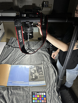    The archivist photographing scrapbooks from the Roy R. Neuberger Papers.    Photo by Diana Puglisi. 