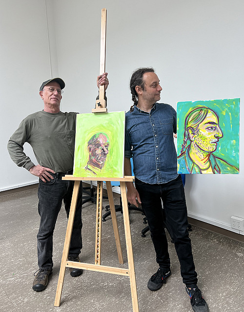 NEU Vitality Art Workshop (NVA) participant Arthur Fox (l) and teaching artist Benjamin Degen (r) pose with their self-portraits from the...
