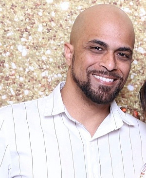 GW wearing white pin stripped shirt